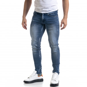 Slim fit мъжки сини дънки с прокъсвания - FASHIONMIX.BG Slim fit мъжки сини дънки с прокъсвания